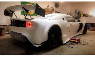 Illustration for article titled Praise All That Is Unholy: Here's A BMW V10 Swapped Into A Lotus Elise